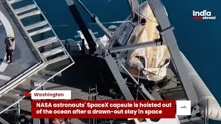 NASA astronauts' SpaceX capsule is hoisted out of the ocean after a drawn-out stay in space