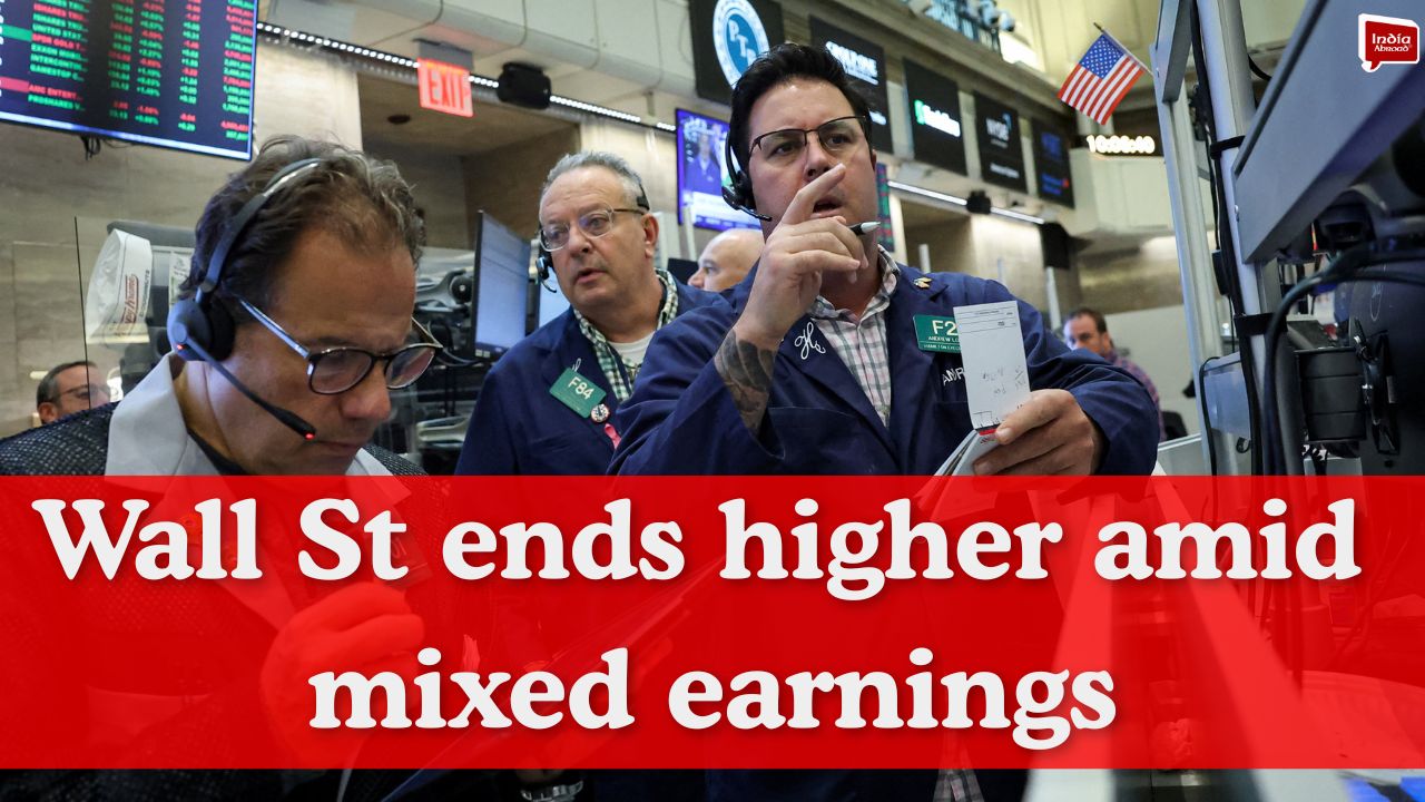Wall St ends higher amid mixed earnings